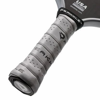 Close-up image of the handle of one of the best long handle pickleball paddles with a white background.